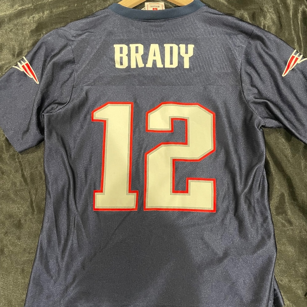 woman's New England patriots jersey. med size Tom Brady jersey.